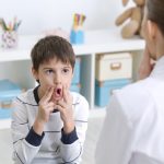 Cute little boy at speech therapist office